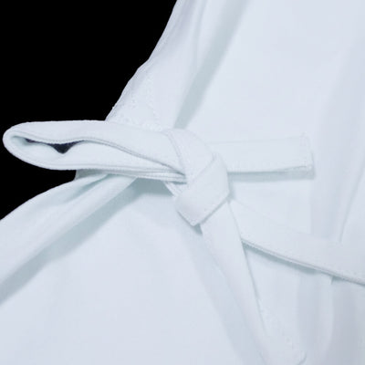 Two double strings sewed at the bottom of the vest
